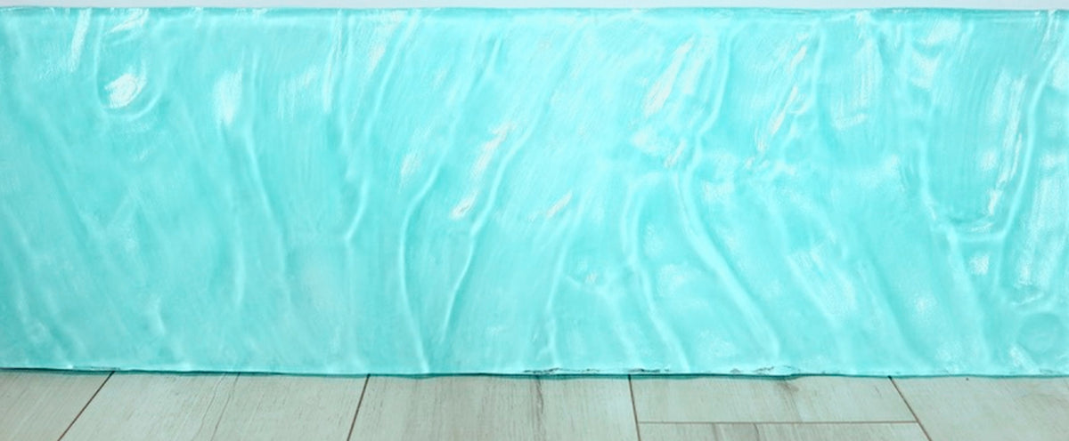 Blue-green poured resin artwork by Ashley Mossy
