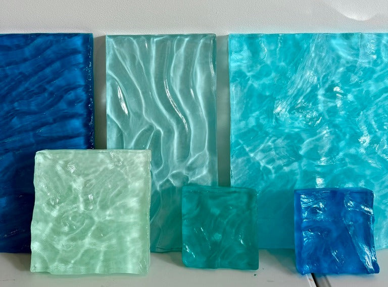 Poured resin pieces in blues, greens and turquoise